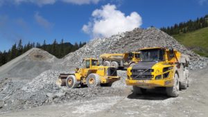 Gravel site and trucks.