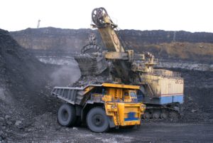 What Is Moly Grease? 3 Loading a heavy tractor with gravel.