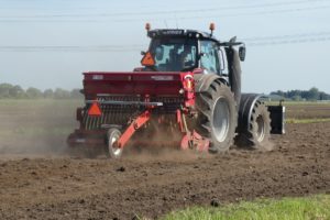 What Is Moly Grease? 7 Tractor tilling soil.