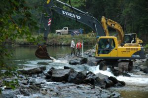 Heavy equipment in a stream.