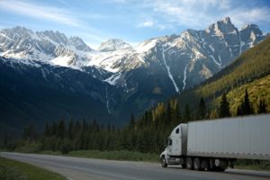 White semi truck in the mountains.