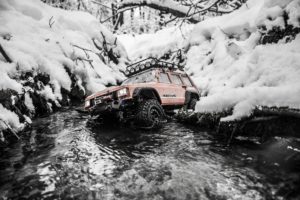 Jeep in snowy water.