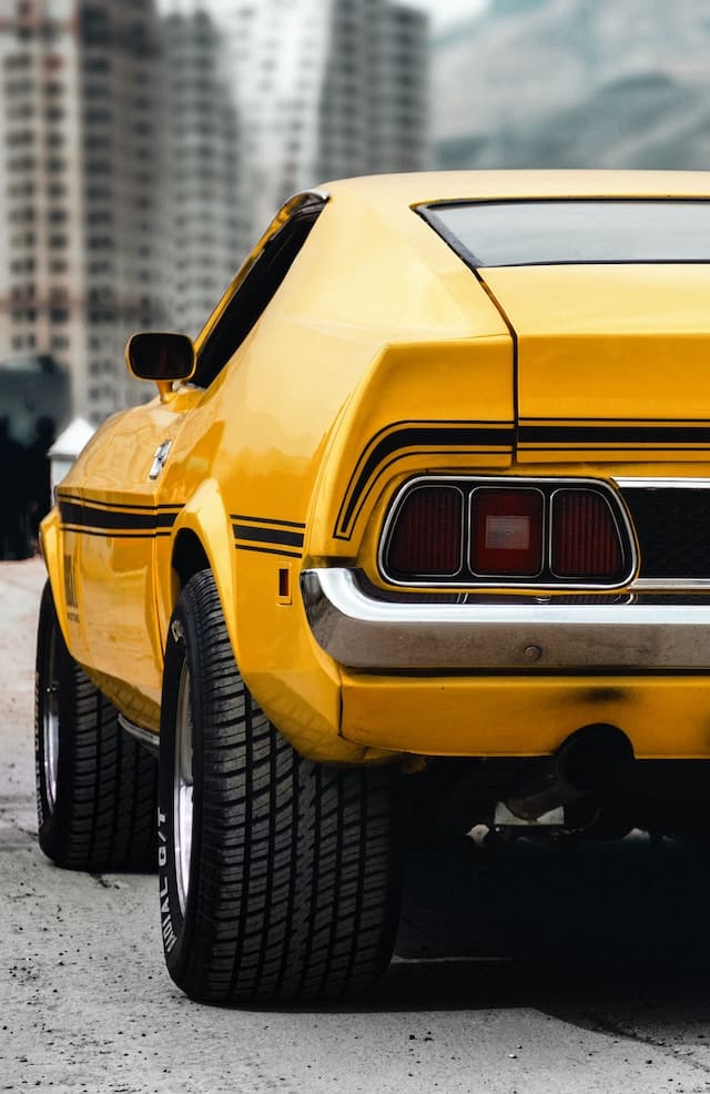 Featured image for "Best Motor Oil For Muscle Cars" blog post. Yellow muscle car.