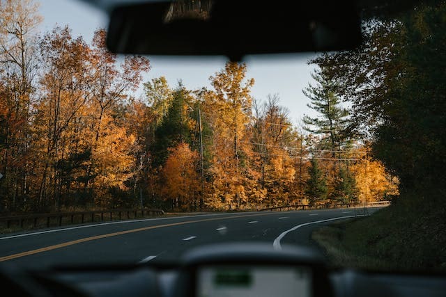 Featured image for "2019 Lincoln Navigator Oil Type" blog post. Looking through windshield on the road.
