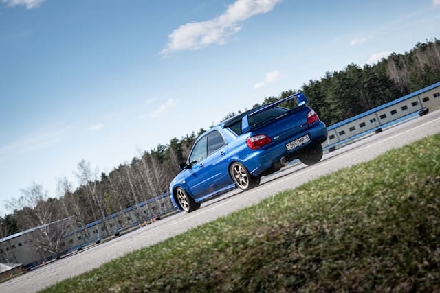 Featured image for "Best 0W 20 Synthetic Oil for Subaru" blog post. Blue Subaru.