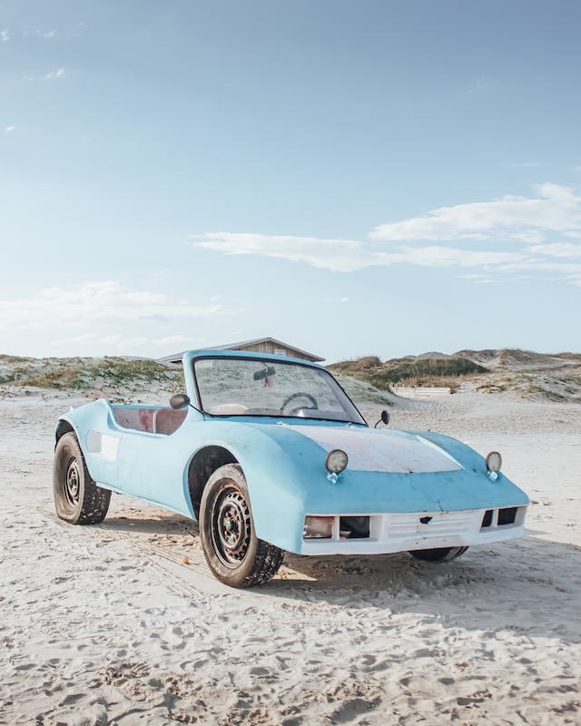 Featured image for "Best Synchromesh Transmission Fluid" blog post. Car on beach.