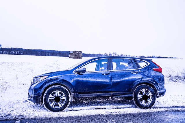 Featured image for "2022 Honda* CRV* Hybrid Oil Type" blog post. Honda CRV in the snow.