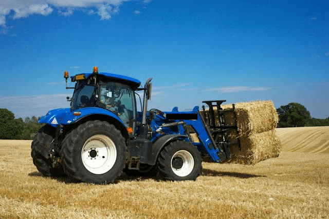 Featured image for "Boosting Productivity: Unleashing Efficiency with the New Holland* T6* 180 Tractor" blog post. New Holland tractor.