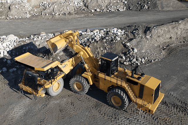 Featured image for "Cracking the Code: Demystifying the Dominance of Caterpillar* 994K's Engine" blog post. CAT loader.