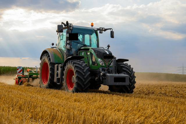 Featured image for "Revolutionizing Agriculture: Unleashing the Power of the Fendt* 930* Farm Tractor" blog post. Green Fendt tractor.