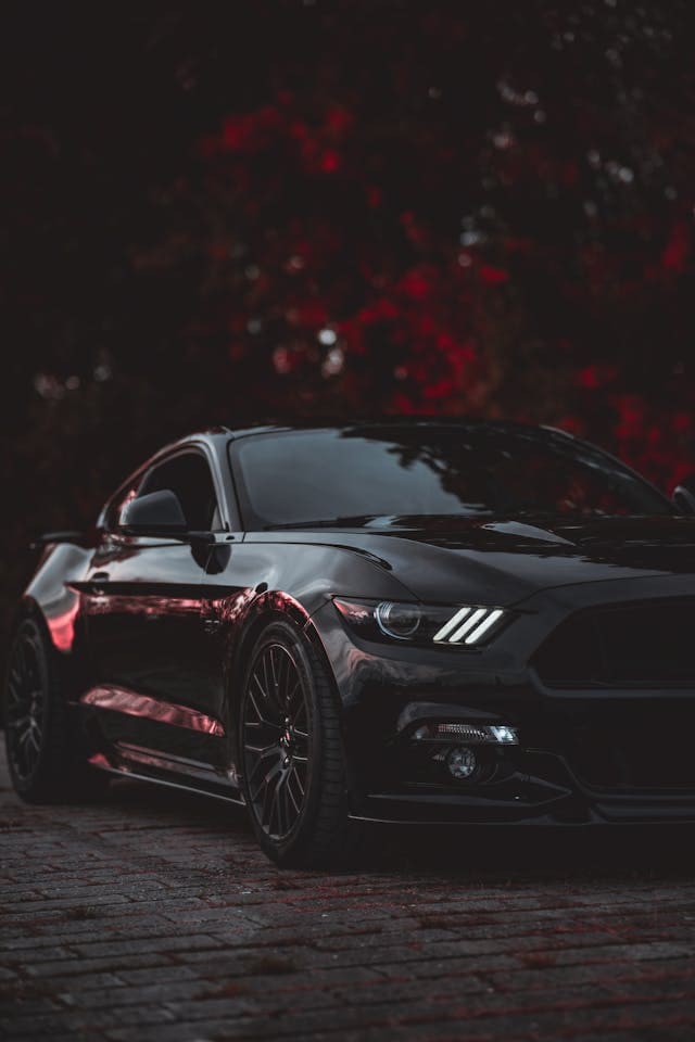 Featured image for "The Innovations of Synthetic Oil Technology For Your 2024 Ford* Mustang* Dark Horse*" blog post. Black Mustang.