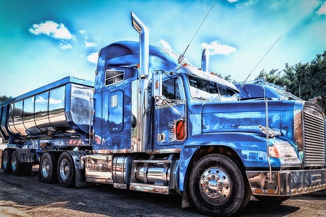 Featured image for "Changing Oil in Diesel Engines: A Proactive Approach to Engine Longevity" blog post. Blue semi truck.