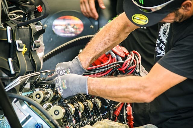 Featured image for "The Essential Guide to Engine Assembly Lube for High-Performance Engine Builders" blog post. Man mechanic.